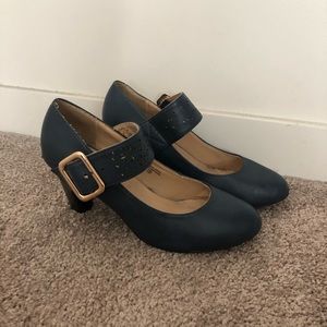 Navy blue heels with gold buckle